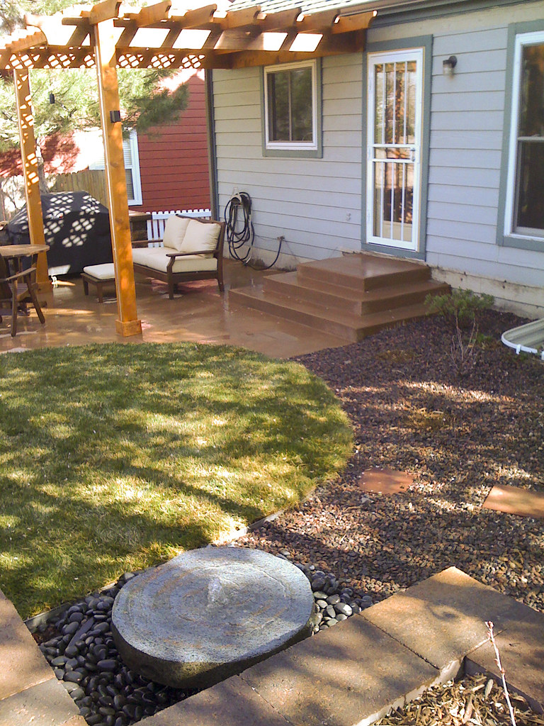Underused side plot to social patio garden